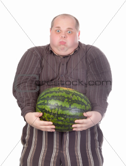 Fat man struggling to hold the weight of a whole watermelon