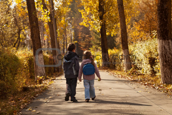 Kids walking in early autumn