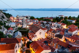 Aerial View on Illuminated Town of Omis in the Evening, Croatia