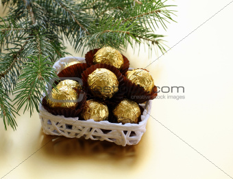 chocolate truffles in a gift box under the Christmas tree