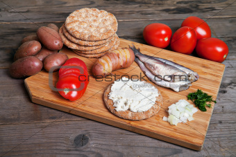 Swedish herring and ingredients on the cutting board
