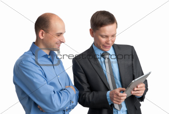 Businessmen meeting and looking at tablet computer