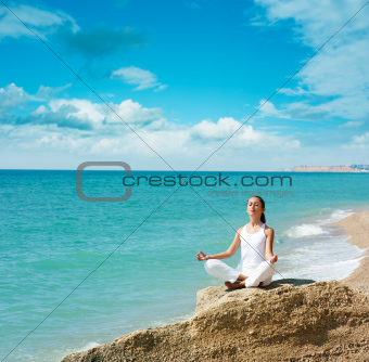Woman Doing Yoga near the Sea