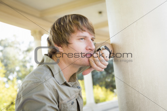 Handsome Thinking Young Adult Man Portrait Outside.