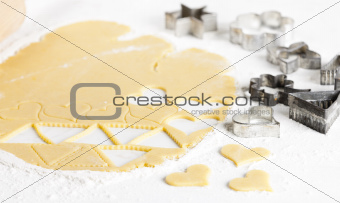 still life of dough with cookie cutters