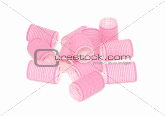Twelve pink velcro rollers in a jumbled pile