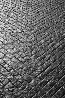 Grey cobbled street in a V shape