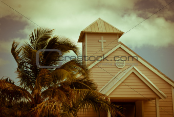 Wooden white church and palm trees, Bahamas