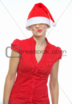Thoughtful young woman with Christmas hat over eyes