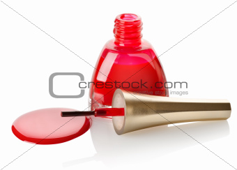 Red nail polish and brush