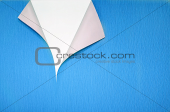 paper with curled corner and copyspace