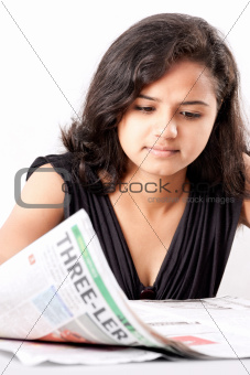 Indian teen reading newspaper