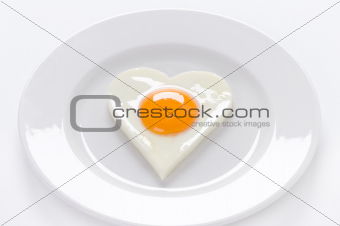 heart shaped egg on a plate