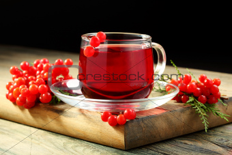 Cup of tea and viburnum berries.