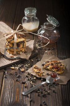 Cookies with jars of jam and condensed milk