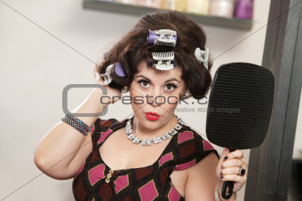 Woman in Curlers Holding Mirror