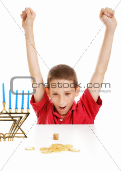 Boy Playing Dreidel on Hanukkah