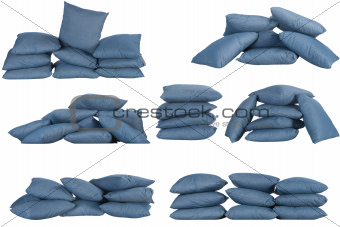 seven stacks of blue denim pillows