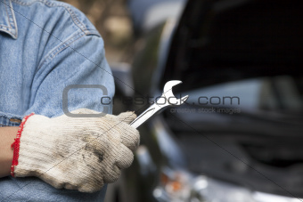 car technician holding the wrench