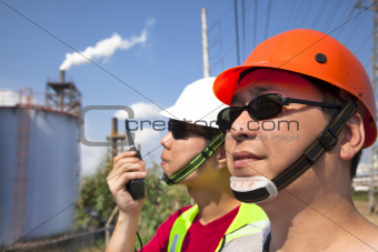 close up of  two asian refinery workers 