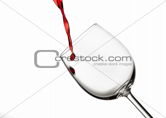 Burgandy red wine poured into a wine glass