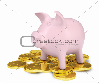 Pink piggy bank standing on a pile of coins with gold