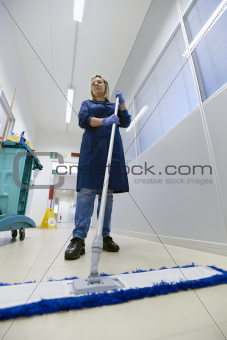 Women at workplace, professional female cleaner sweeping floor i