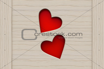 Two red hearts in a wooden board