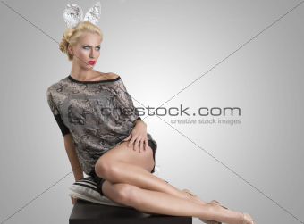sexy girl with silver bunny ears in sensual pose