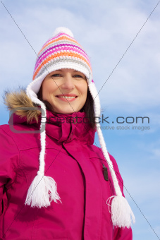 Smiling girl in winter clothes