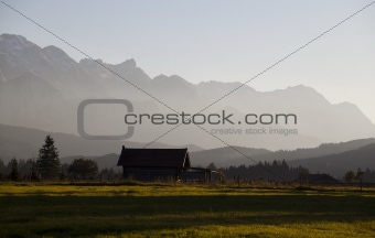 farmhouse in Alps before sunset