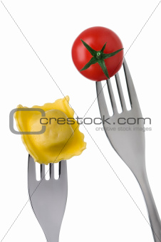 ravioli and tomato on forks