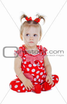 A small child in a red dress