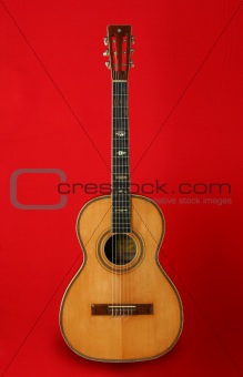 Guitar over red background