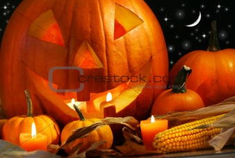 Scarved pumpkin with candles