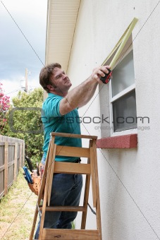 Carpenter Measuring Windows