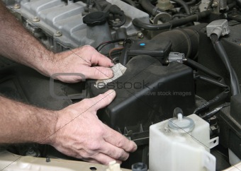 Mechanic Hands On Filter Cover