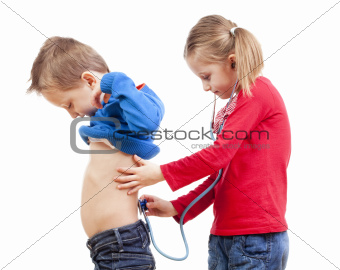 brother and sister playing a doctor with stethoscope - isolated on white