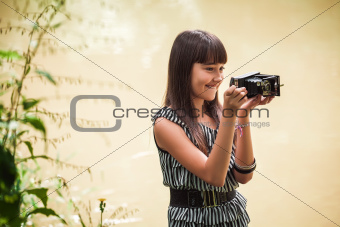 Girl with antique camera