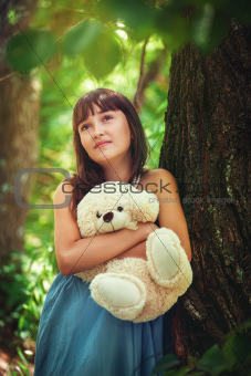 Girl staying near the tree