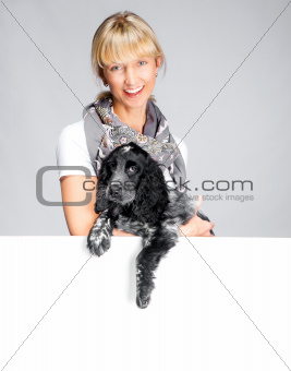 dog and smiling woman with white banner