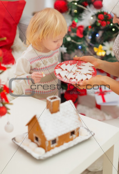 Baby girl enjoying Christmas cookies