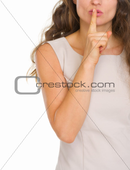 Closeup on woman showing shh.. gesture