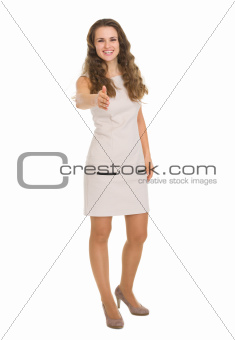 Happy young woman stretching hand for handshake