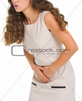 Closeup on woman having stomach pain