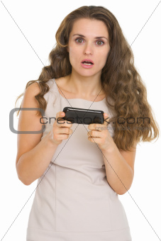 Surprised woman reading sms
