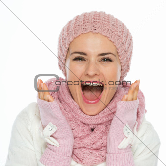 Surprised young woman in knit winter clothing
