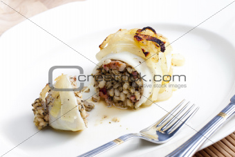 sepia filled with pearl barley baked with onion