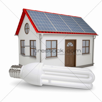 Energy saving lamp on the background of the house with solar panels
