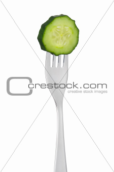 cucumber slice on a fork isolated